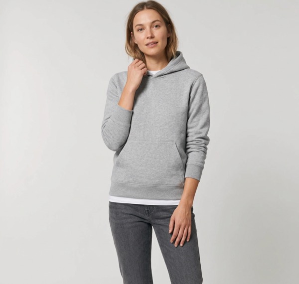 A woman wearing the grey hoodie with jeans